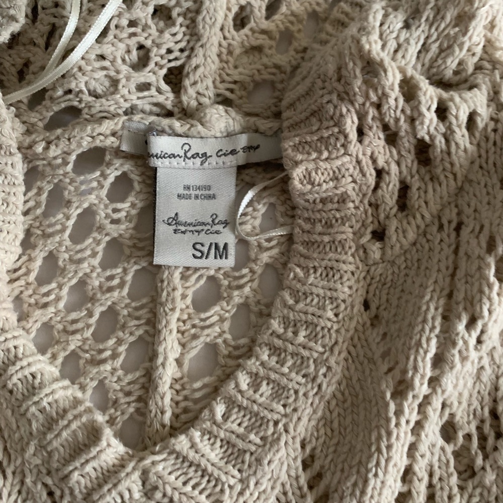 Fringed comfy cream colored crocheted hoodie